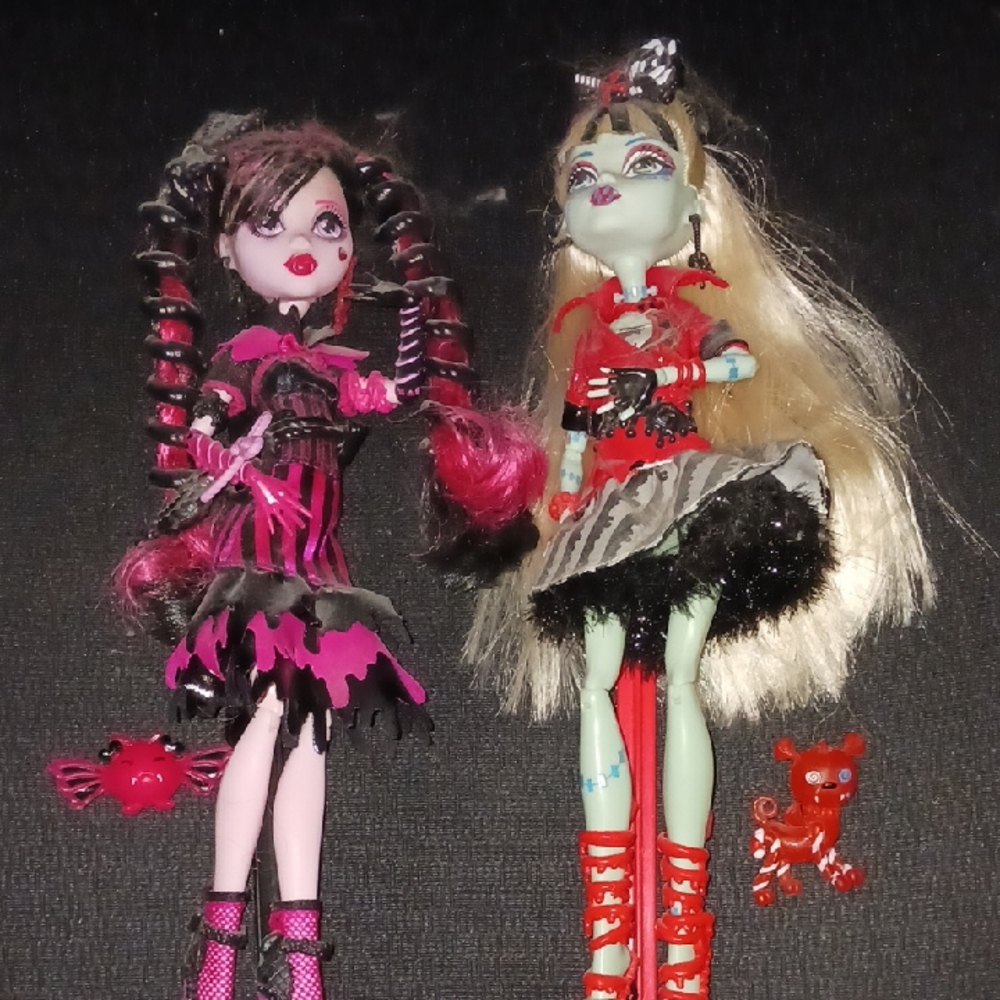 Monster High Dolls with Pink and Red Outfits